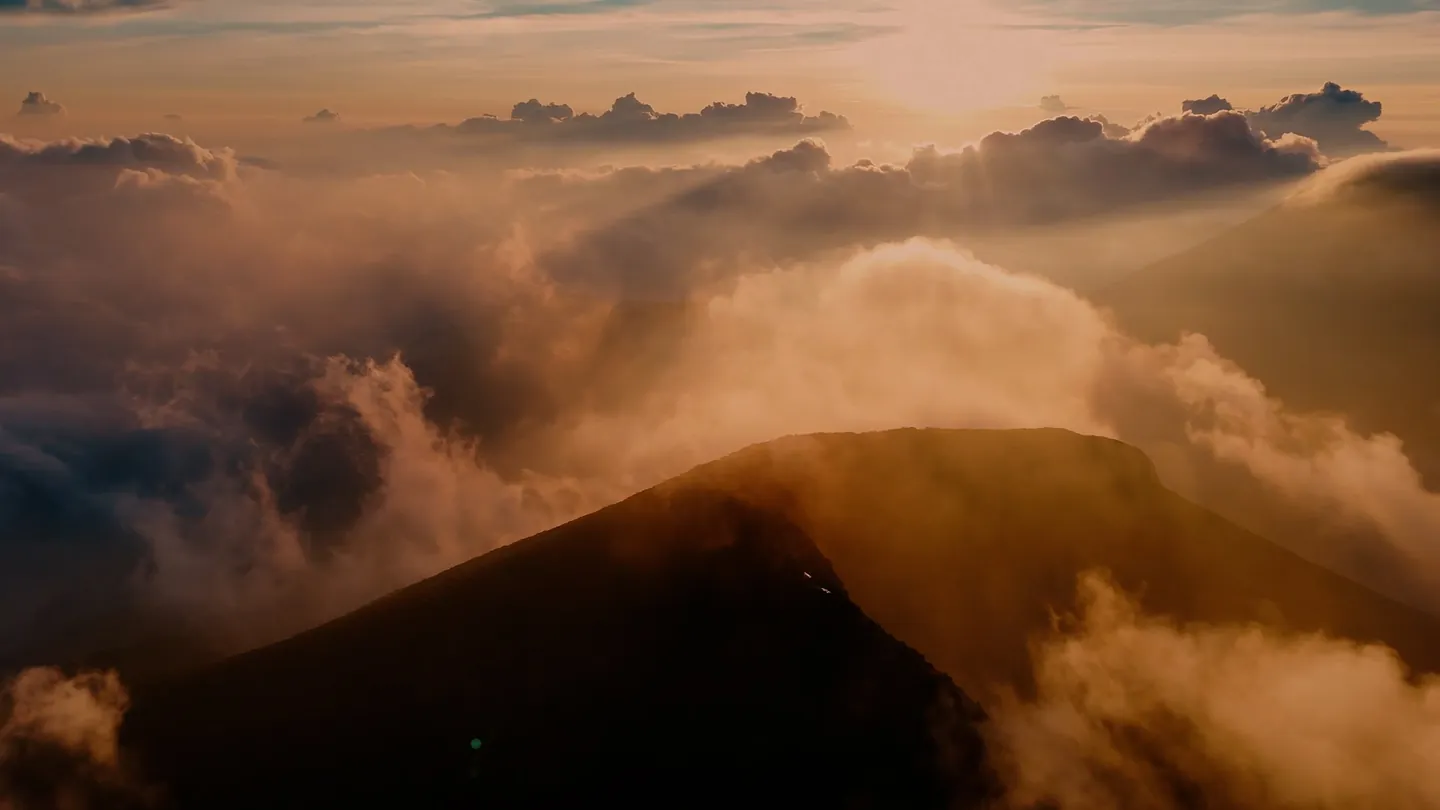 Sunset glow over the Pangrango ridge and a sea of clouds